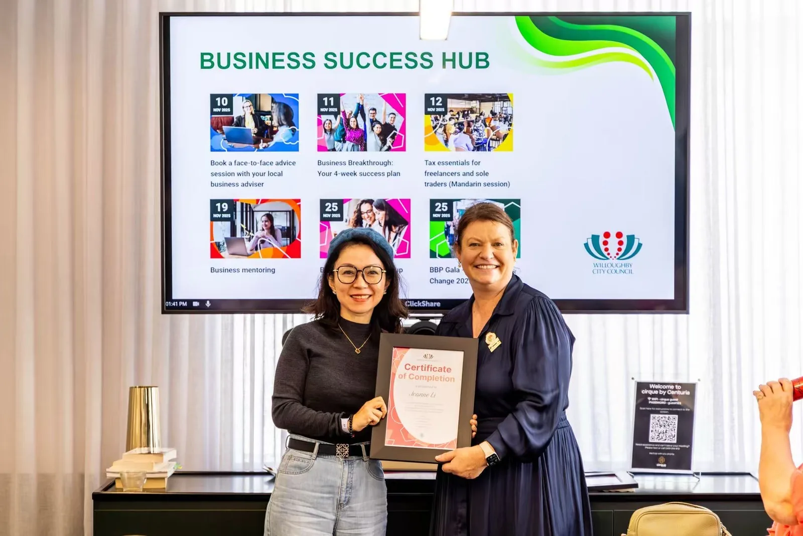 Joanne Li receiving a Certificate of Completion at the Business Success Hub, Chatswood
